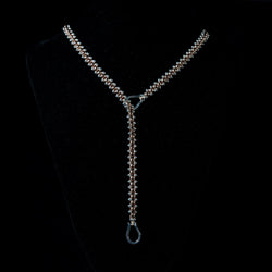 Collana intrecciata con sfere in bronzo